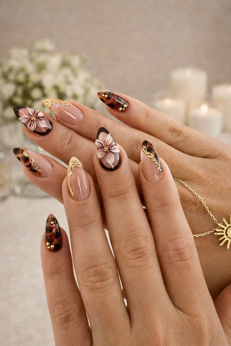 Tap gel nails with floral nail art design, featuring soft neutral tones and 3D textured details on almond-shaped nails