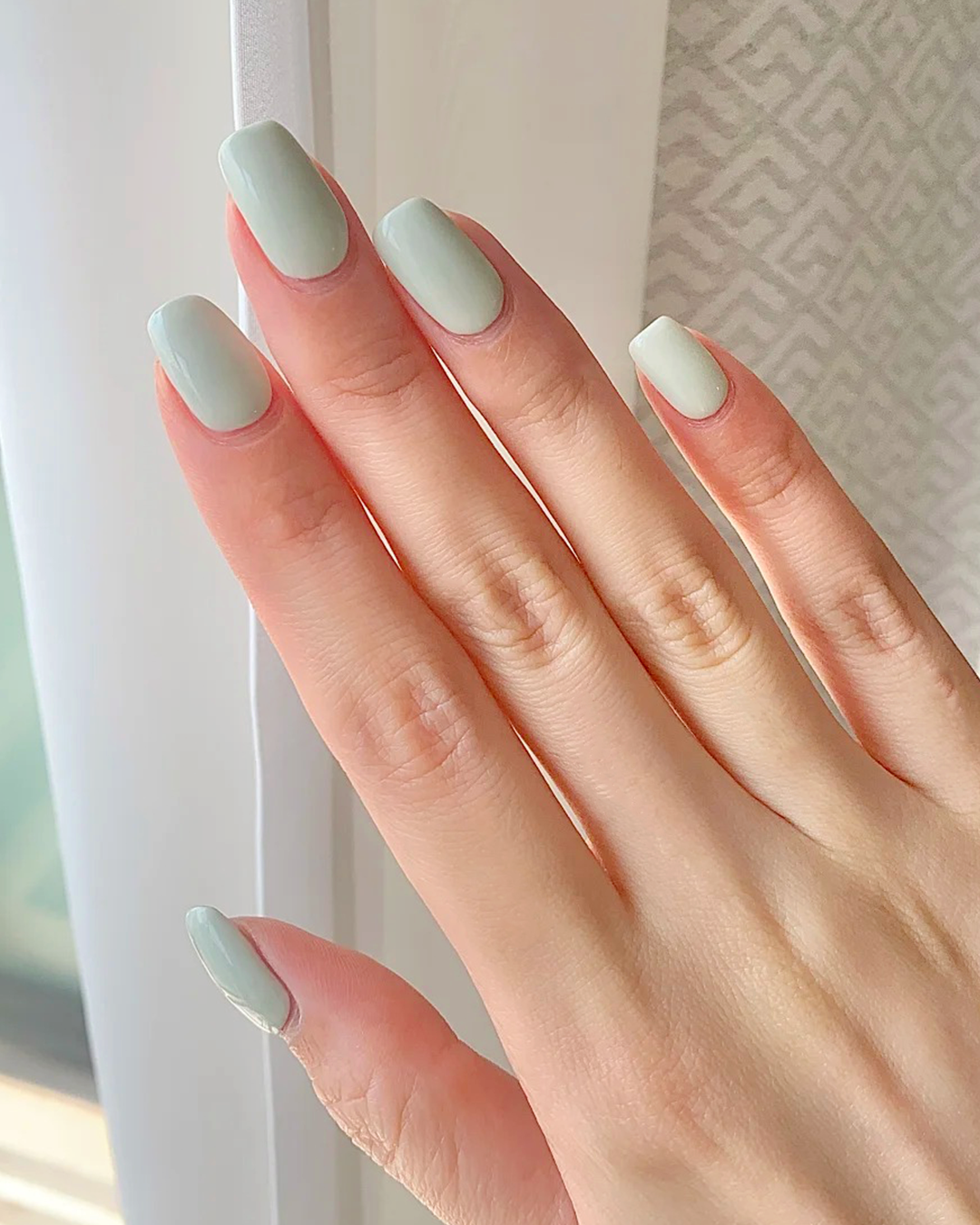Mint green short nails with pastel clean finish