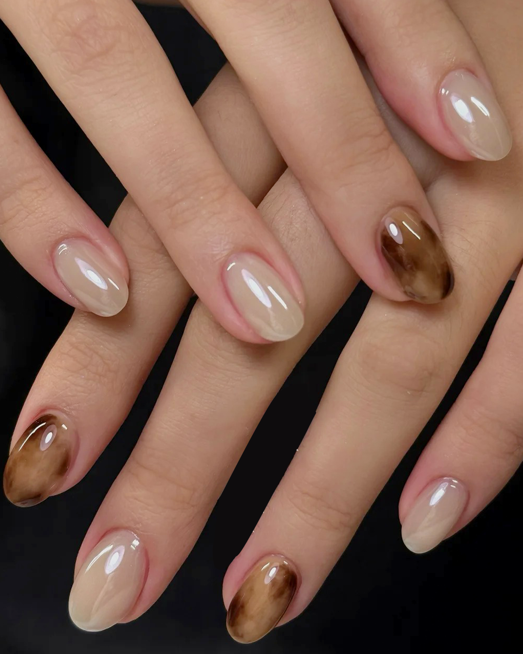 Nude marble short nails with brown abstract swirl design