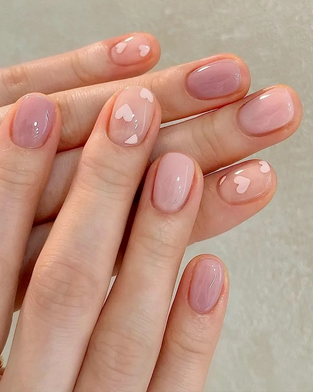 Best Short Nails Trends in Texas: 8 Stylish Designs from Plush Nail Bar You’ll Love 5 Short nails with cute heart accents and glossy pink base