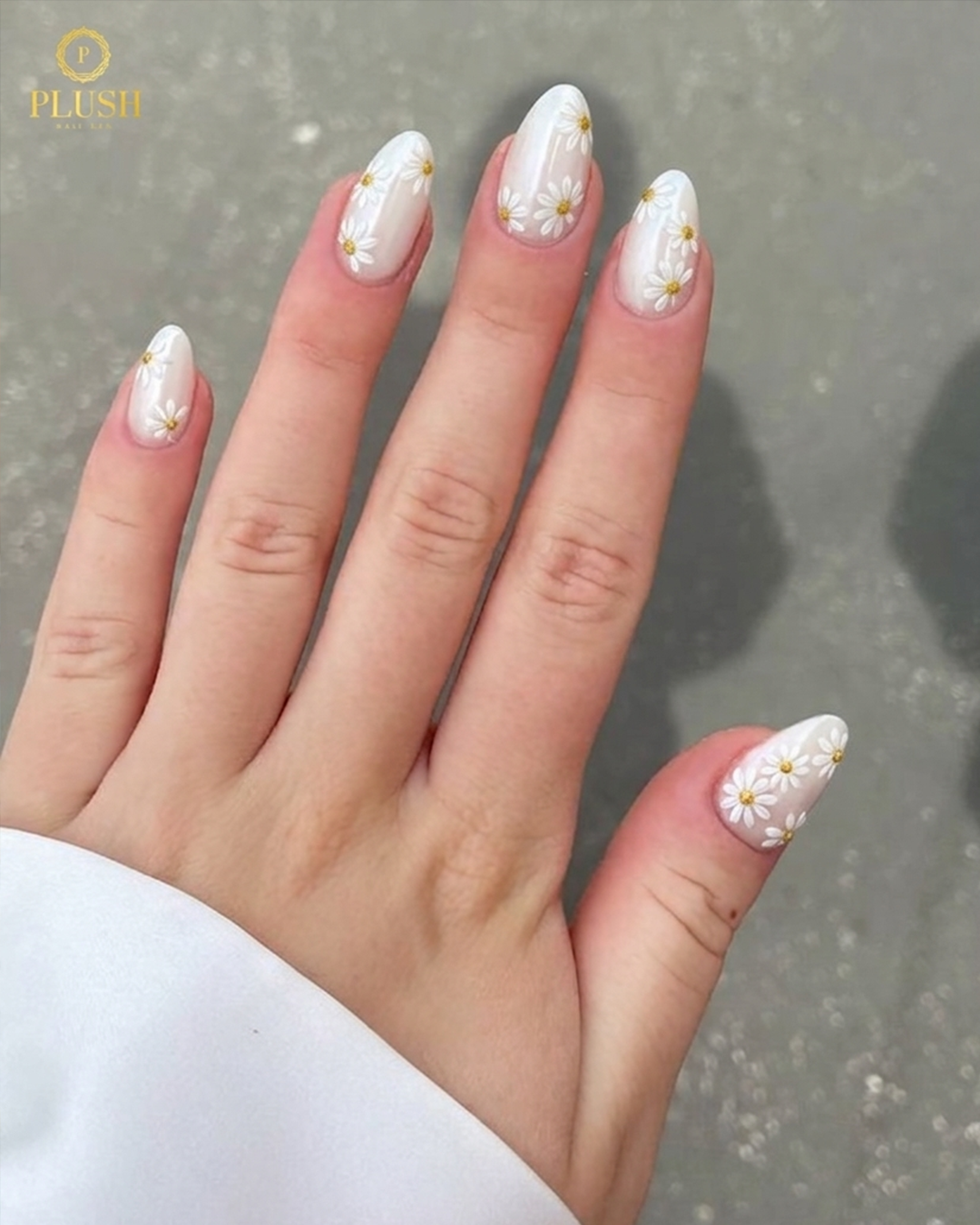 white floral nails with daisy design elegant manicure at nail salon in The Woodlands TX