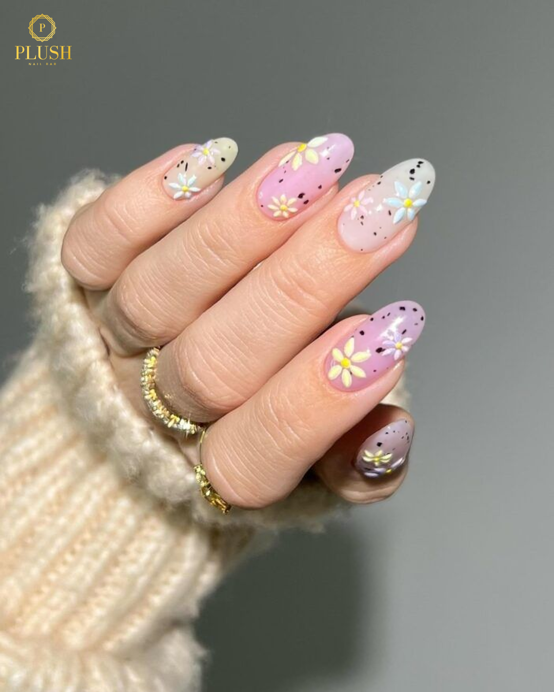 pink daisy nails with speckled design floral nails spring at nail salon in The Woodlands TX