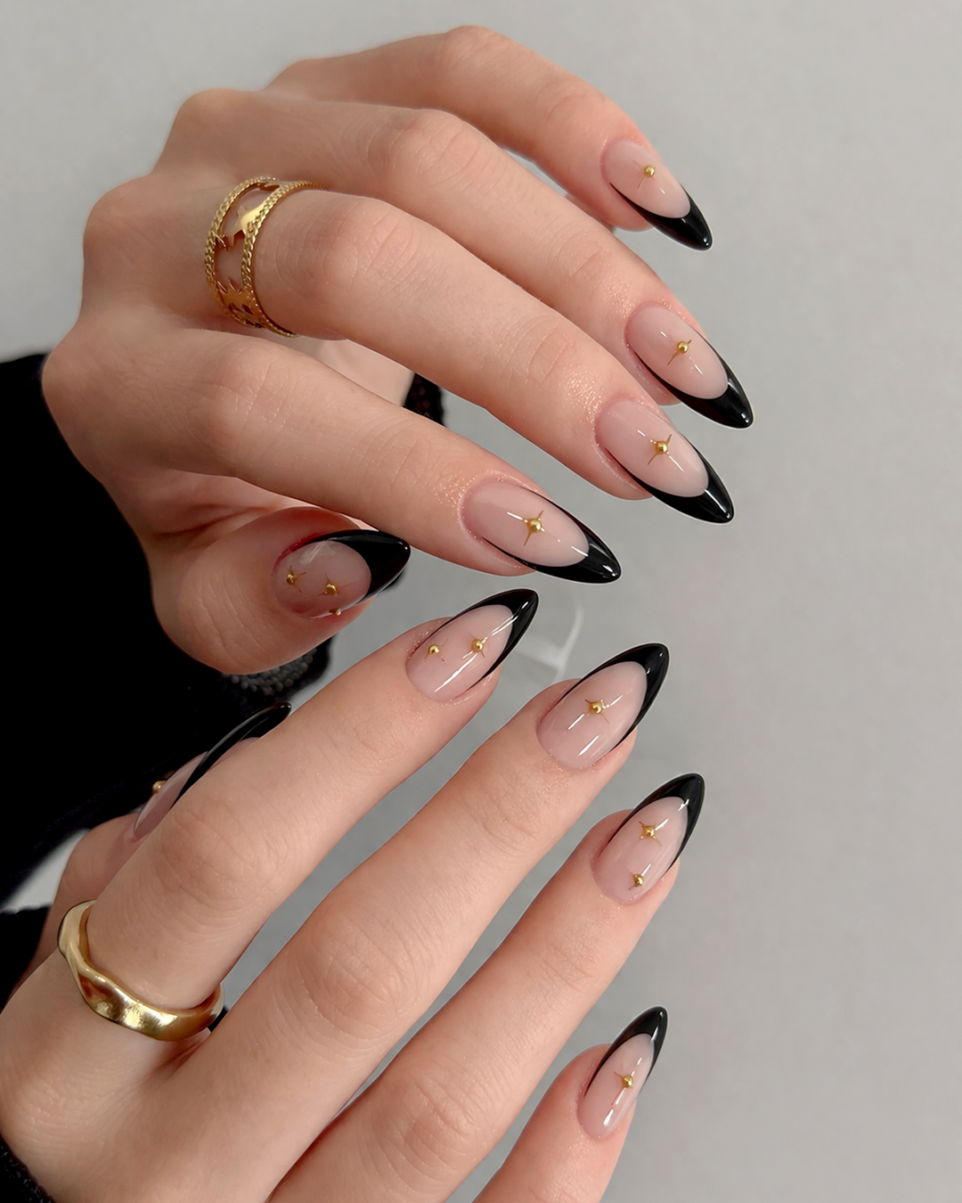 Black French tip Prom Nails with gold accents at Plush Nail Bar Willis, bold and edgy prom nail design