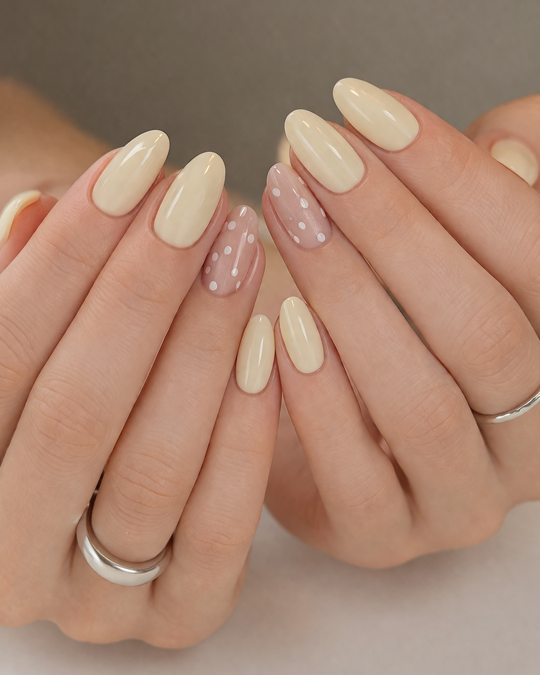 Creamy vanilla glossy Prom Nails with subtle dot accents at Plush Nail Bar Woodforest, simple and elegant prom manicure