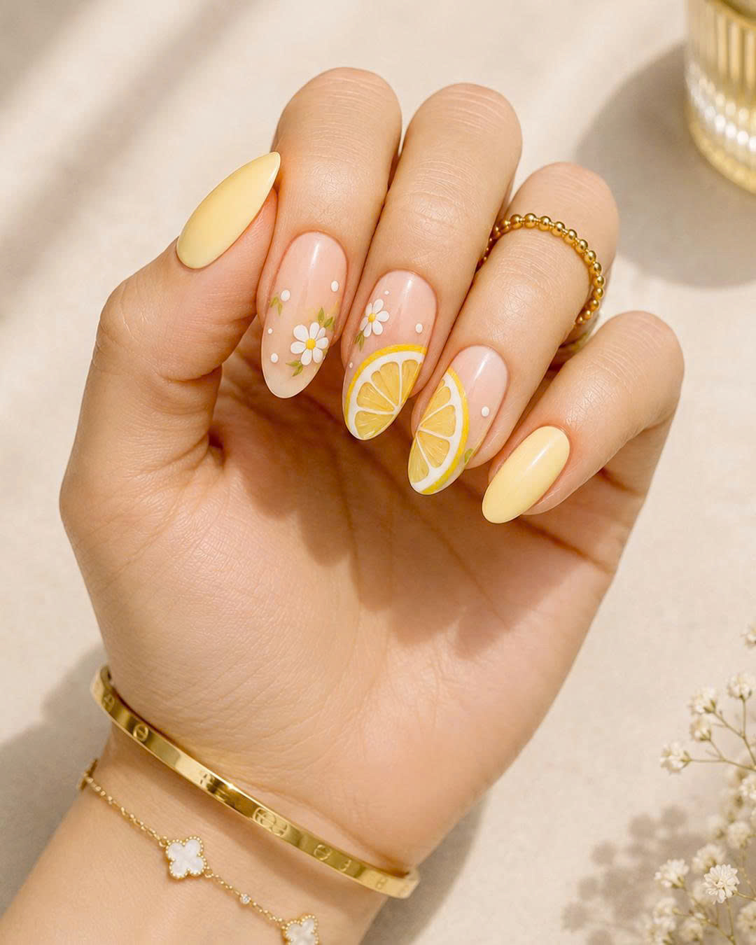 Cute Lemon Nails with daisy flowers and citrus nail art for summer at PLUSH NAIL BAR