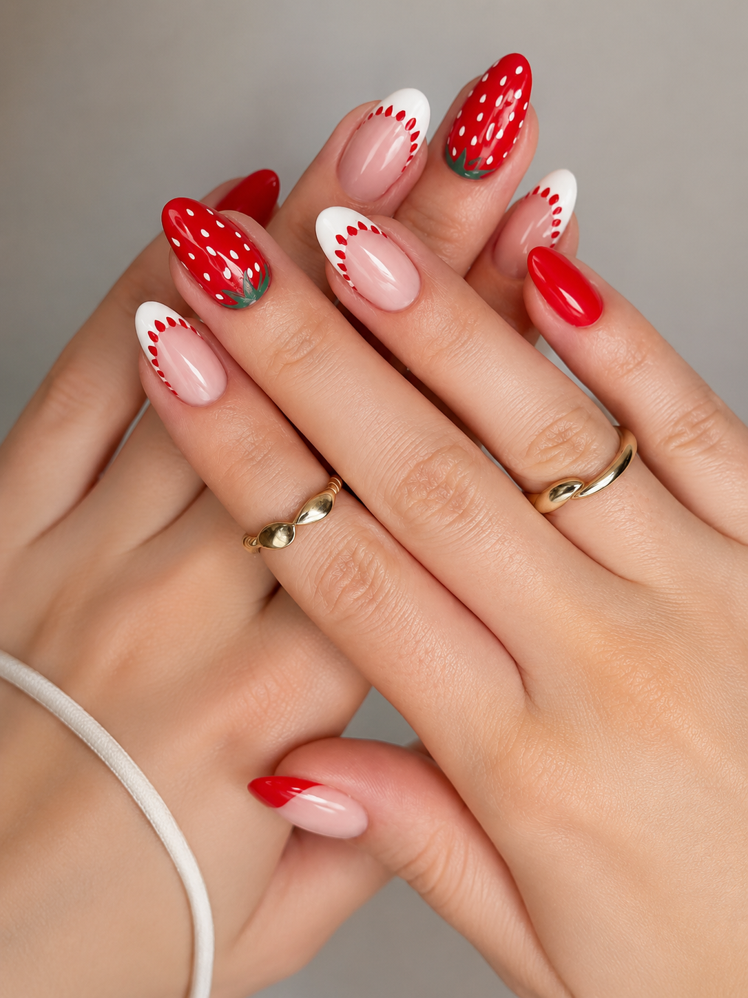 9 Trendy Strawberry Nails for a Sweet Summer in Kingwood, TX 2 Classic strawberry French tip nails with red bases, white seeds, and green leaves for summer.