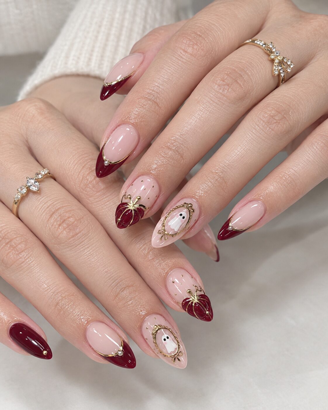 Cute Halloween fall nail art with mini ghosts and 3D crimson pumpkins
