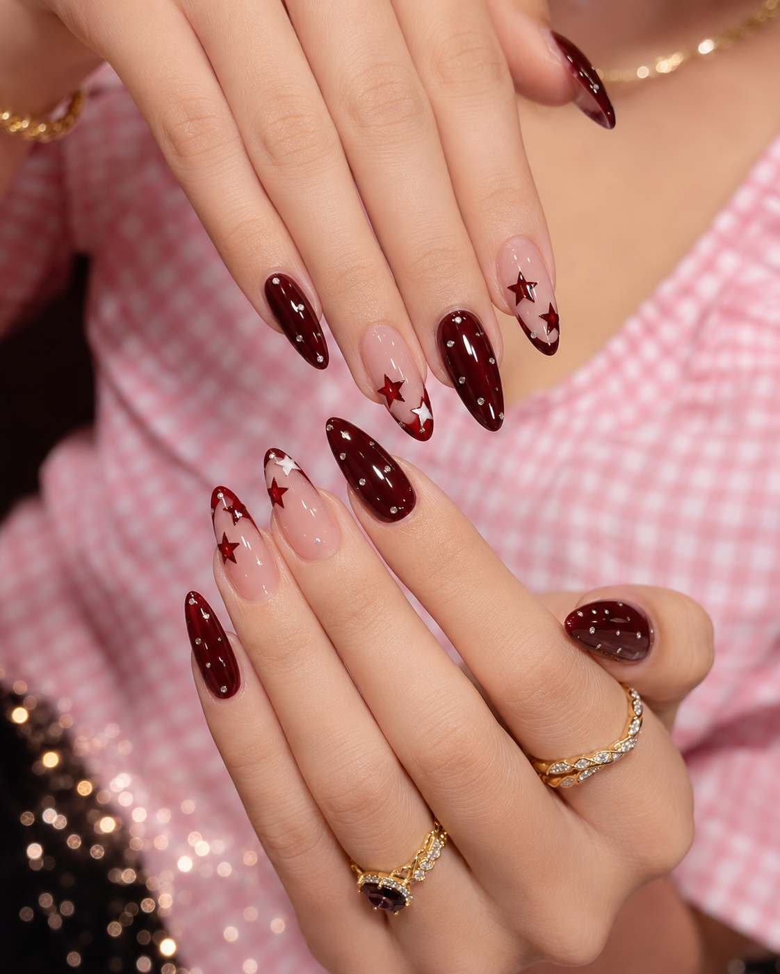 Deep wine and star-accented Homecoming nail ideas on long almond nails with negative space