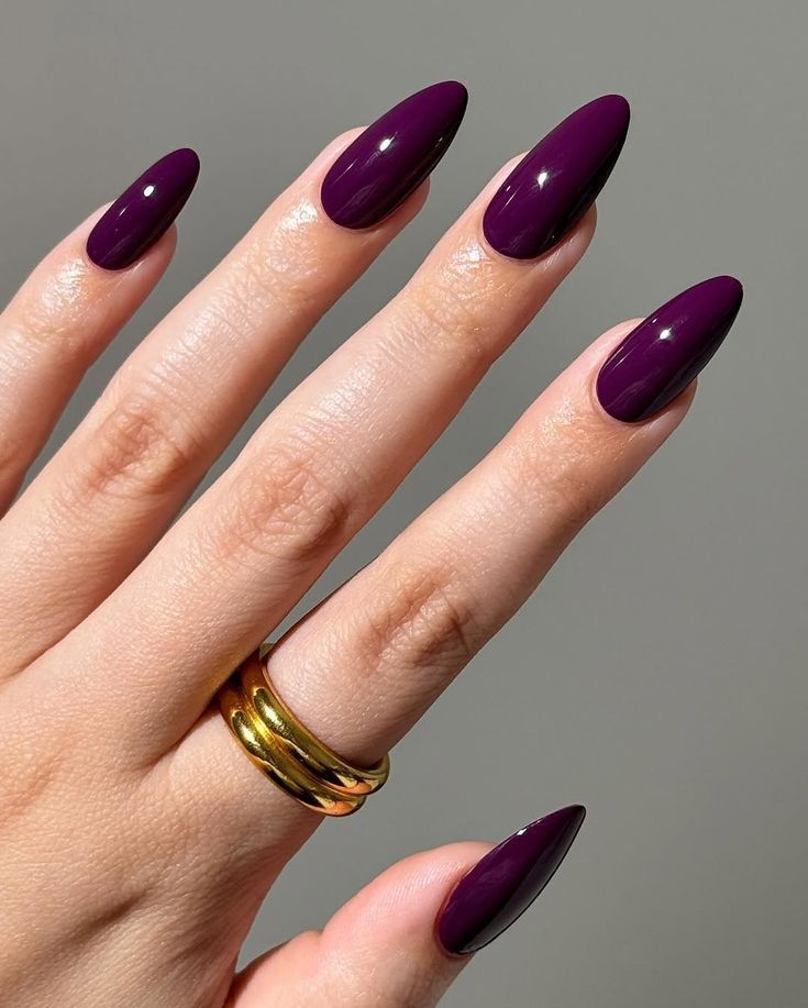Deep plum nail polish on almond nails – Fall Nail Color Trends 2025