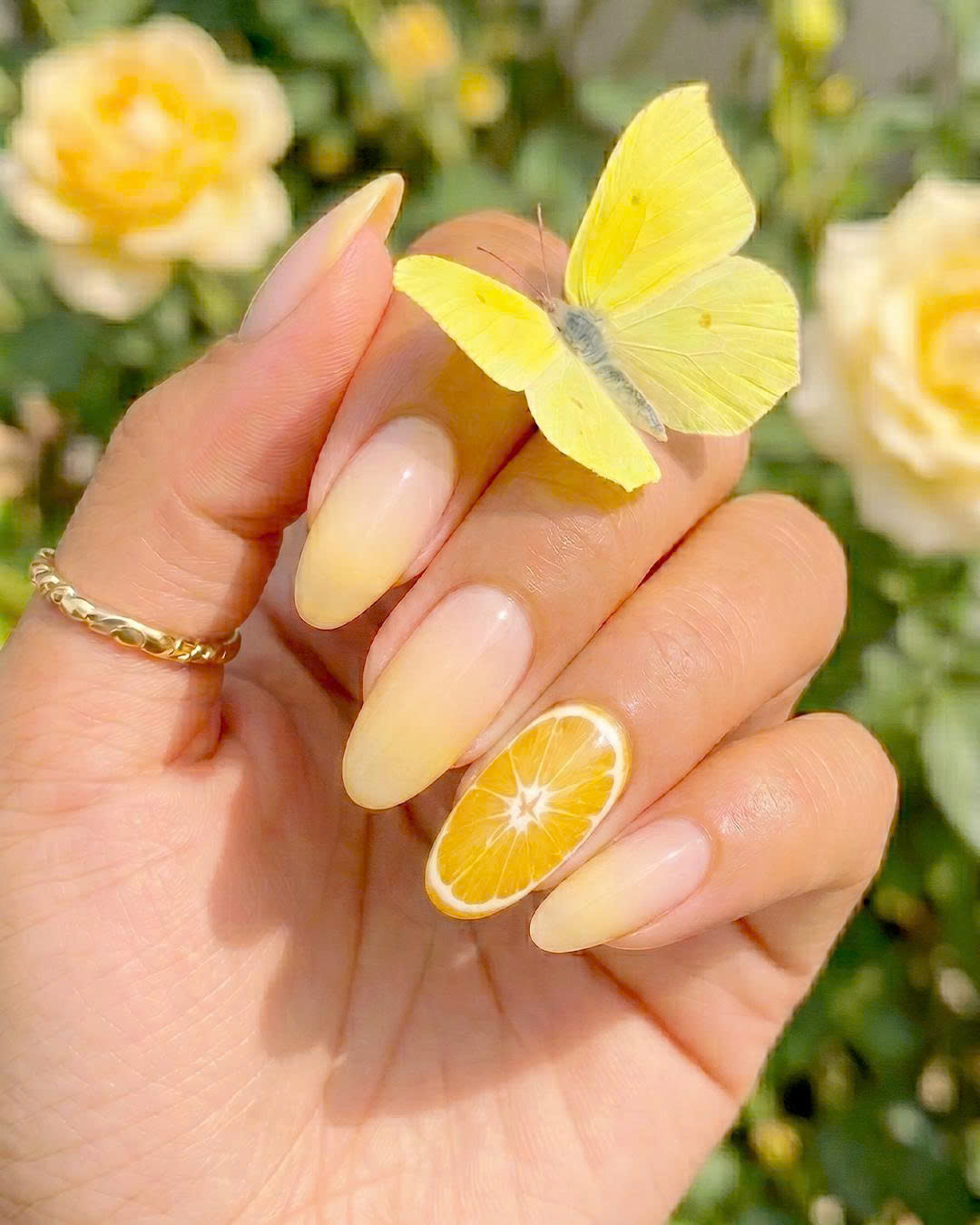 Minimalist Lemon Nails with yellow ombre and realistic lemon accent nail at PLUSH NAIL BAR