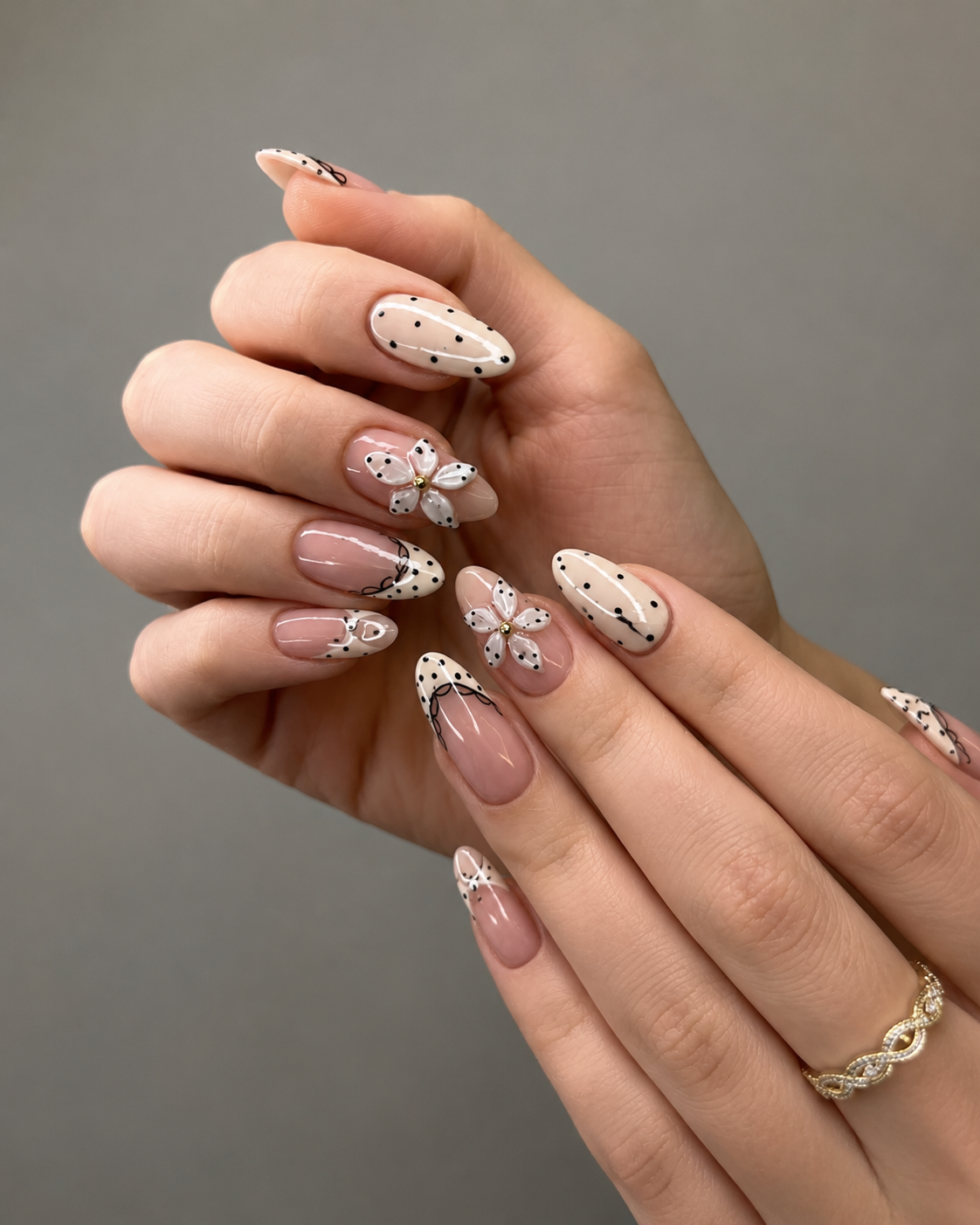 Polka dot and 3D flower french nail with playful dot patterns