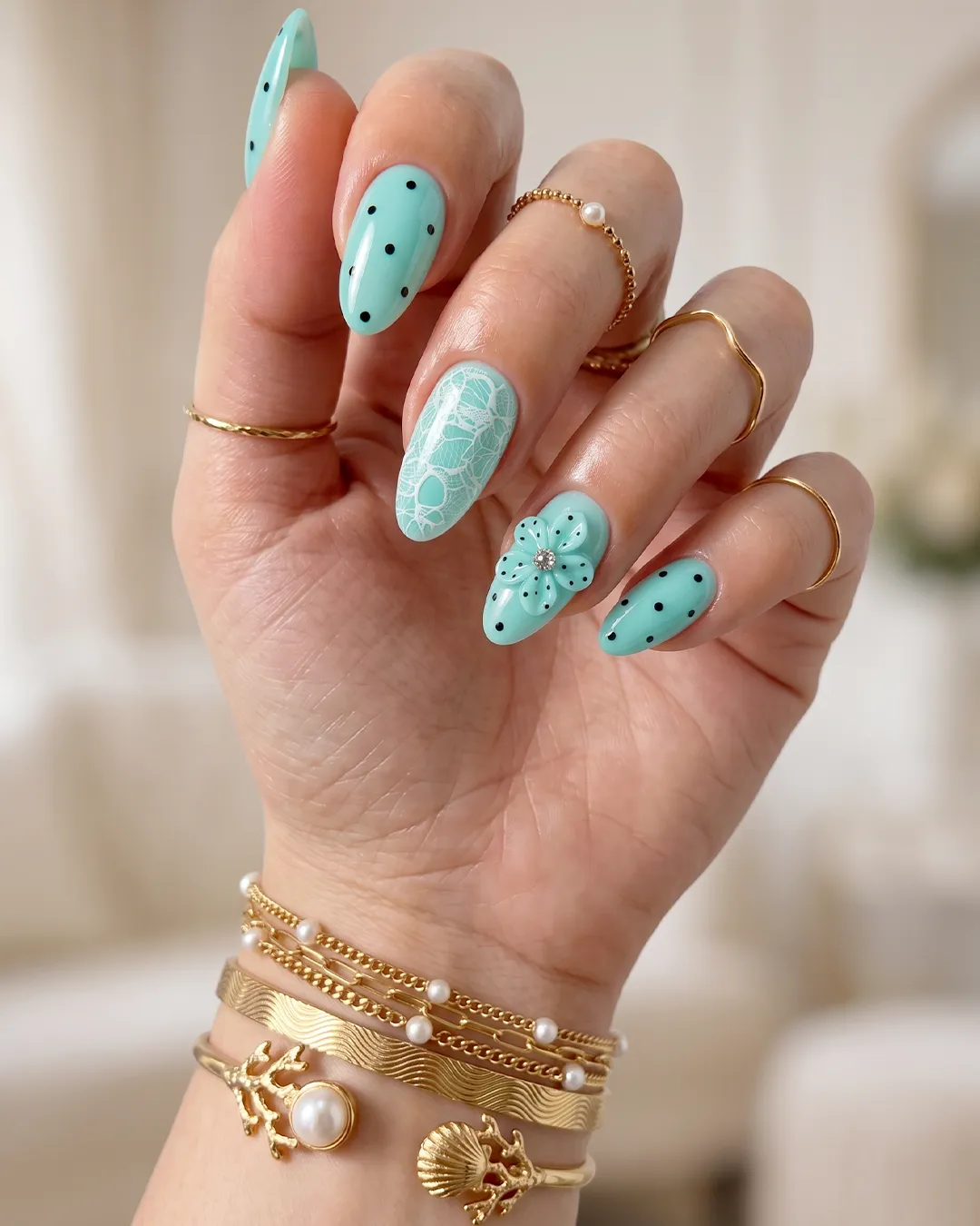 Minimalist Tiffany blue nails with translucent white base and turquoise polka dots
