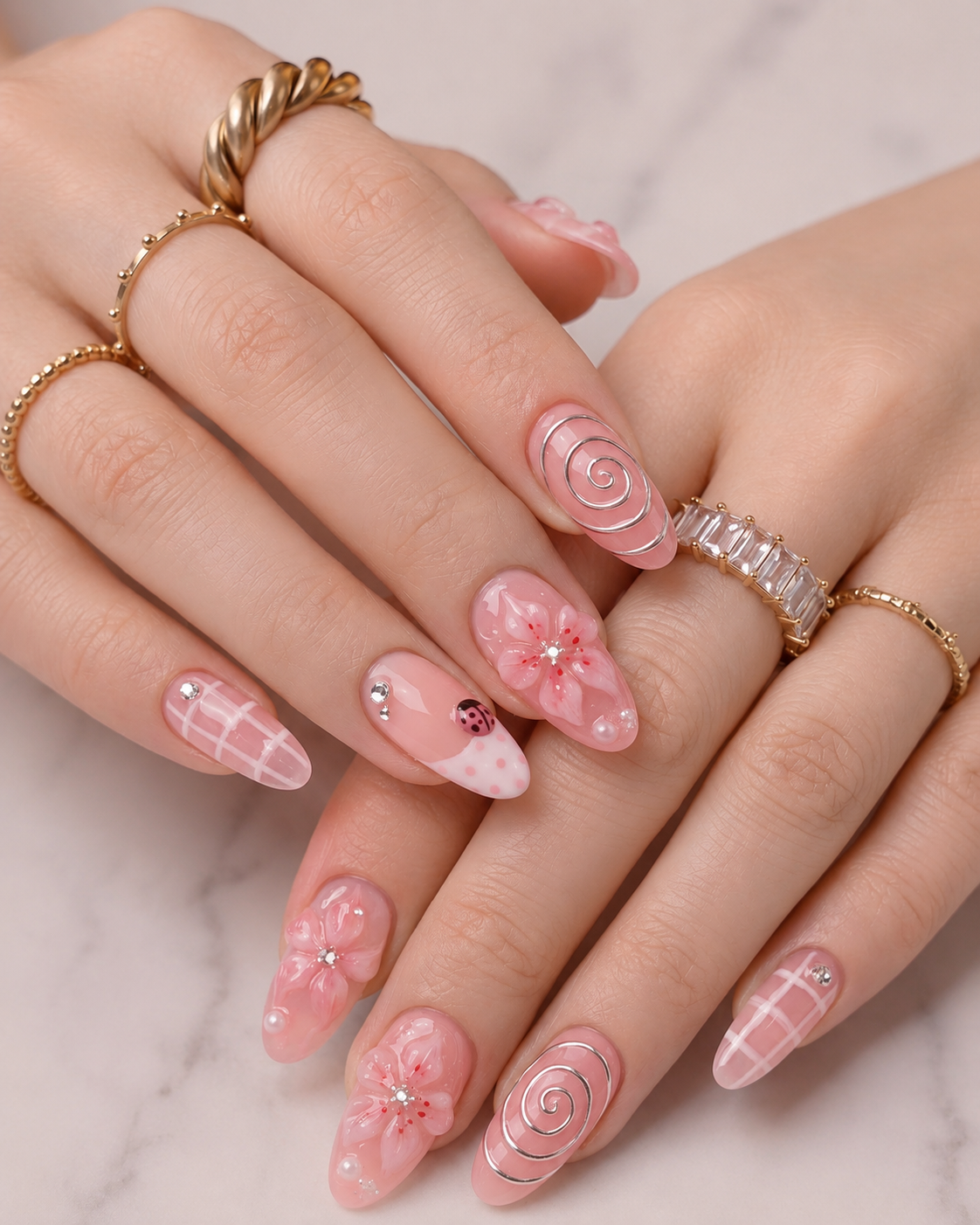 Pink floral nails with plaid accents and 3D flowers