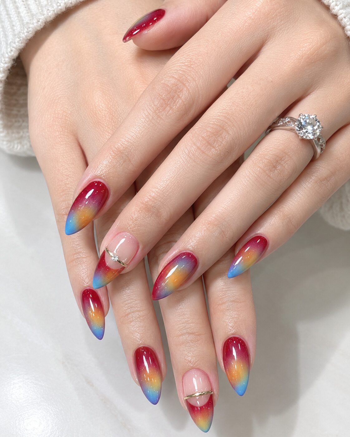 Vibrant fall aura nail art transitioning from warm orange to deep berry red