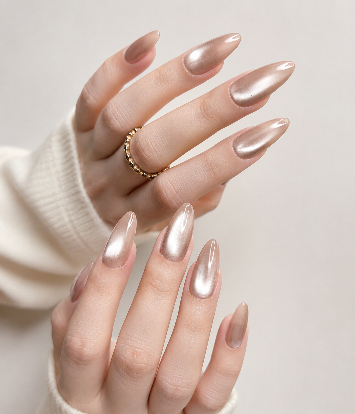 Champagne Chrome Cat Eye Nails featuring multidimensional metallic shimmer on almond nails, creating a sophisticated and modern chrome manicure.