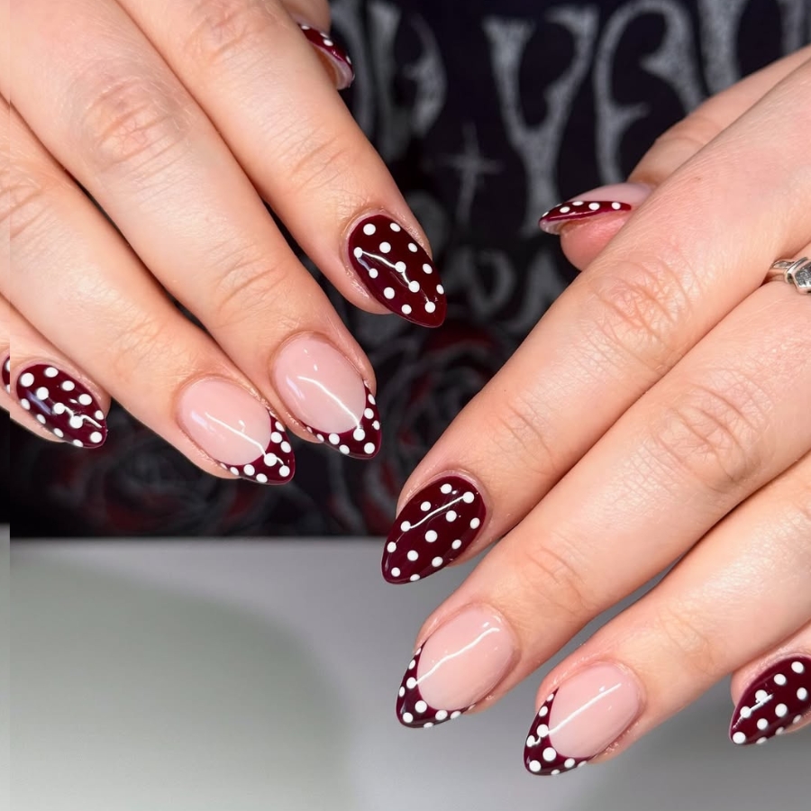 Burgundy French manicure with white polka dots, fun and modern fall nail idea.
