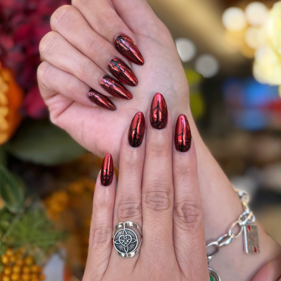 Metallic chrome Burgundy manicure with reflective finish, bold fall nail design.