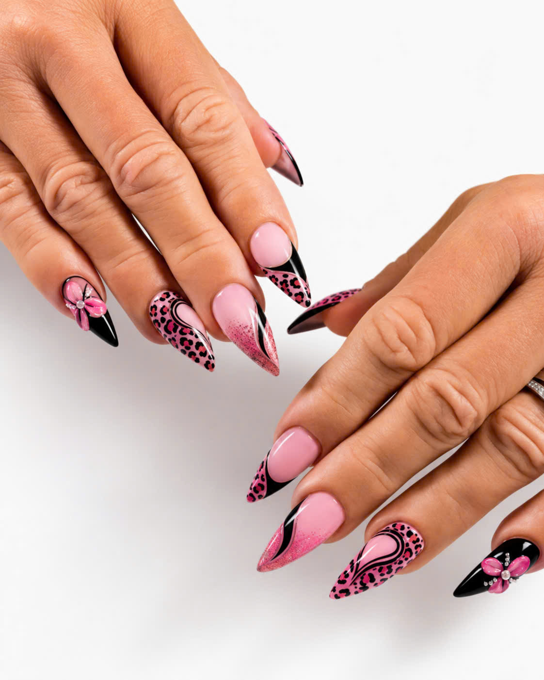 Bold pink leopard nail art with black French tips
