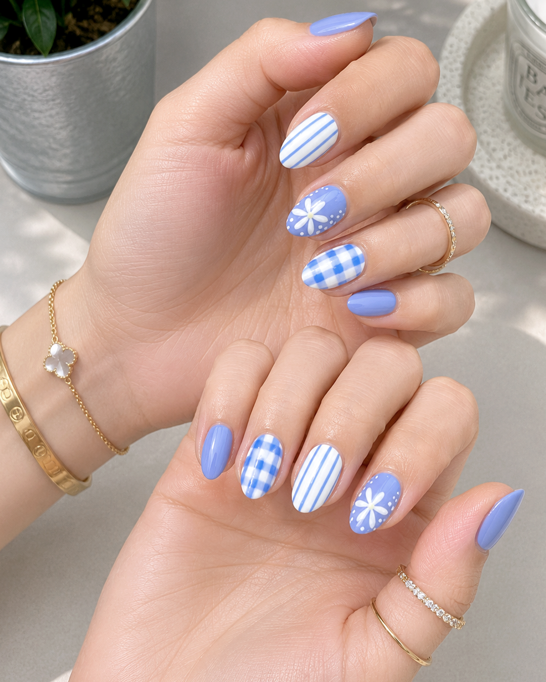 7 Flower Nail Designs for a Fresh, Feminine Manicure 1 A cute blue flower nail design with daisies, stripes, and gingham details for a playful floral manicure.
Alt text: Cute flower nail design featuring soft blue polish, white daisy nail art, striped accents, and gingham details. This fresh floral manicure is perfect for flower nails, cute flower nails, summer flower nails, blue floral nails, and playful flower nail art inspiration.