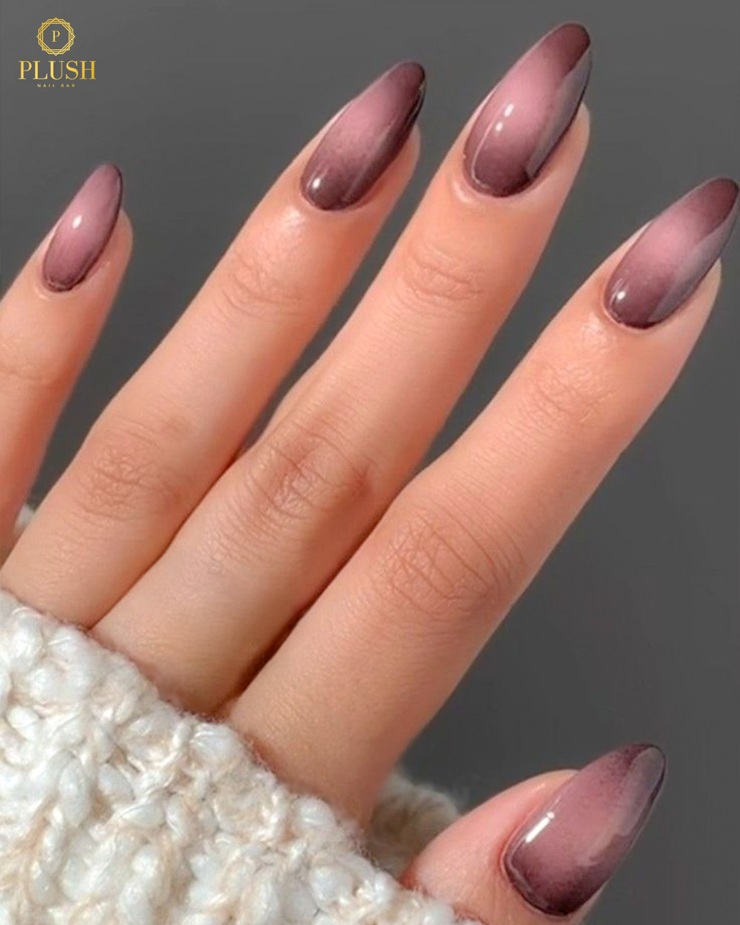 Brown almond nails featuring a magnetic cat-eye gradient effect for added dimension.