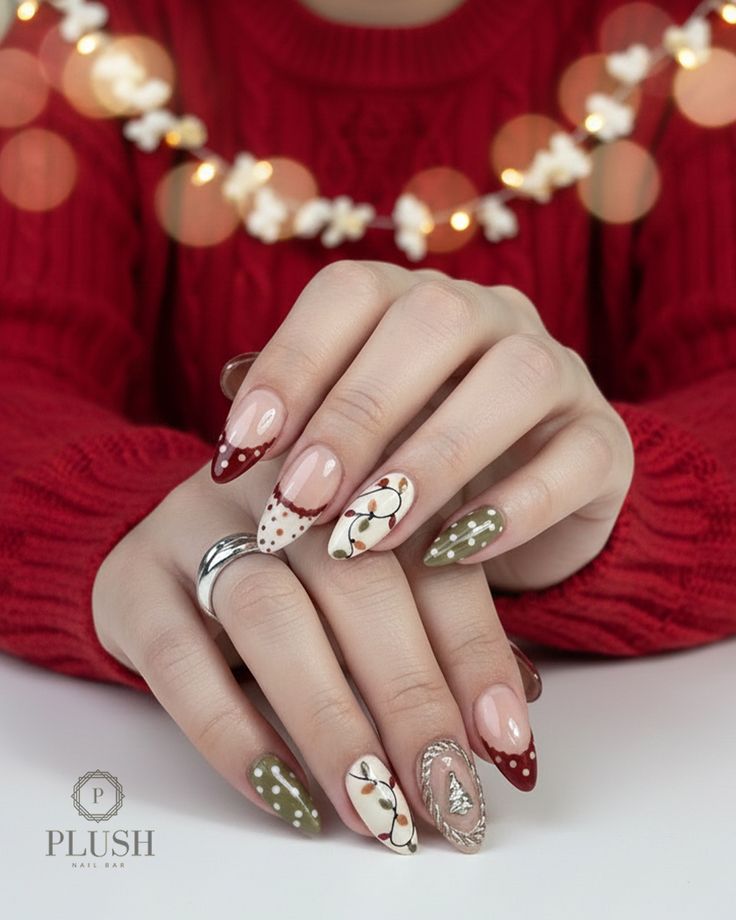 Vintage-style Christmas nails with red berry accents, polka dots, holiday light string art, and textured Christmas tree details by Plush Nail Bar