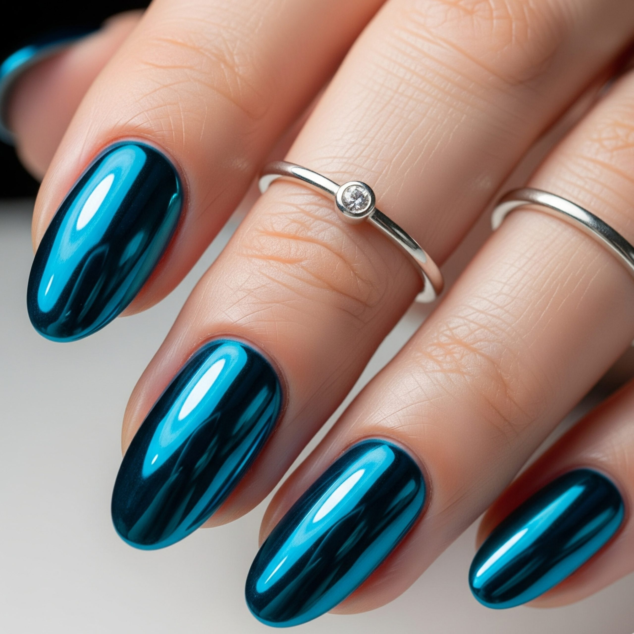 5 Homecoming Nail Ideas 2025 – Fresh, Fun & Fabulous Styles to Try 1 Bold chrome blue homecoming nails with a mirror finish, ideal for making a futuristic statement under the lights.