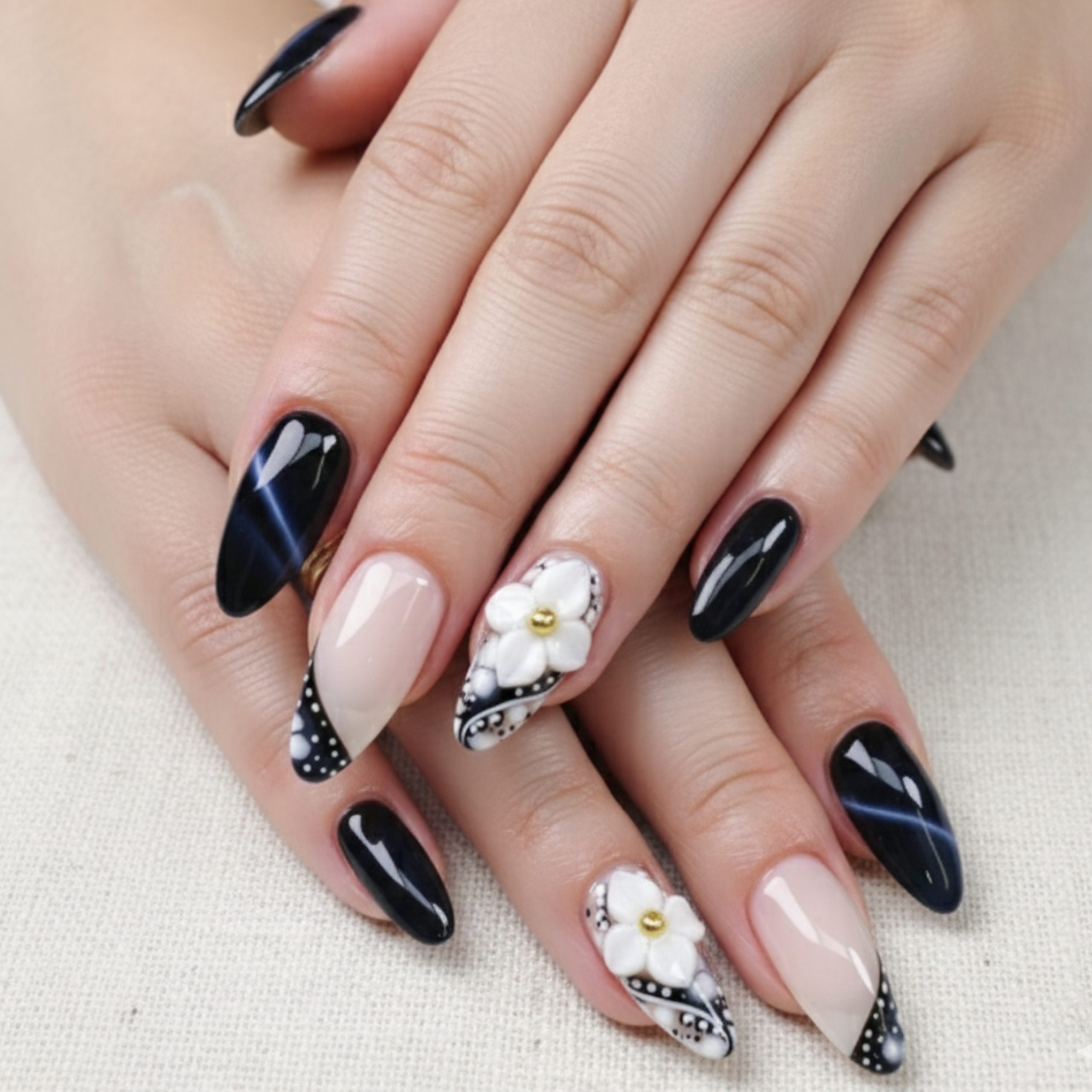 5 Homecoming Nail Ideas 2025 – Fresh, Fun & Fabulous Styles to Try 5 Black and nude homecoming nails with 3D white floral accents and intricate dot detailing – perfect for a dramatic, artistic look.