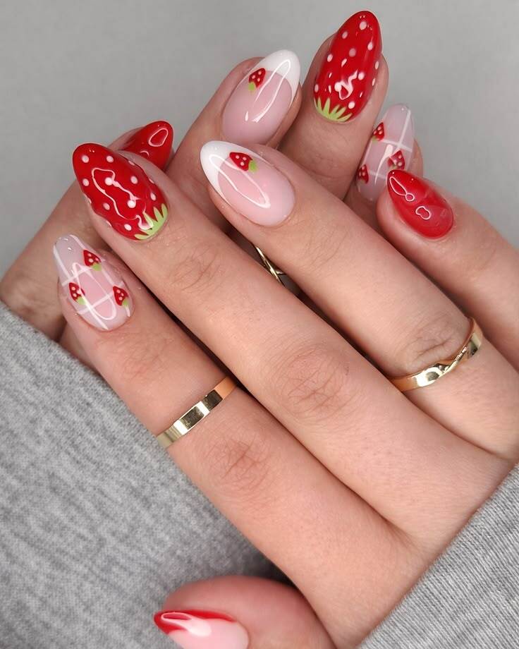 Beautiful mismatched strawberry nails combining white French tips, pink gingham plaid patterns, and full hand-painted berries.