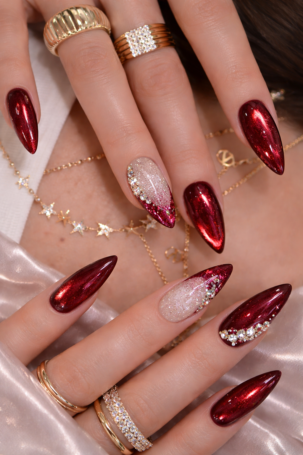 Show-stopping Deep Red Crystal Statement Nails by Plush Nail Bar. Intricate custom large rhinestone artistry and diamond-style placement on dramatic tapered coffin extensions