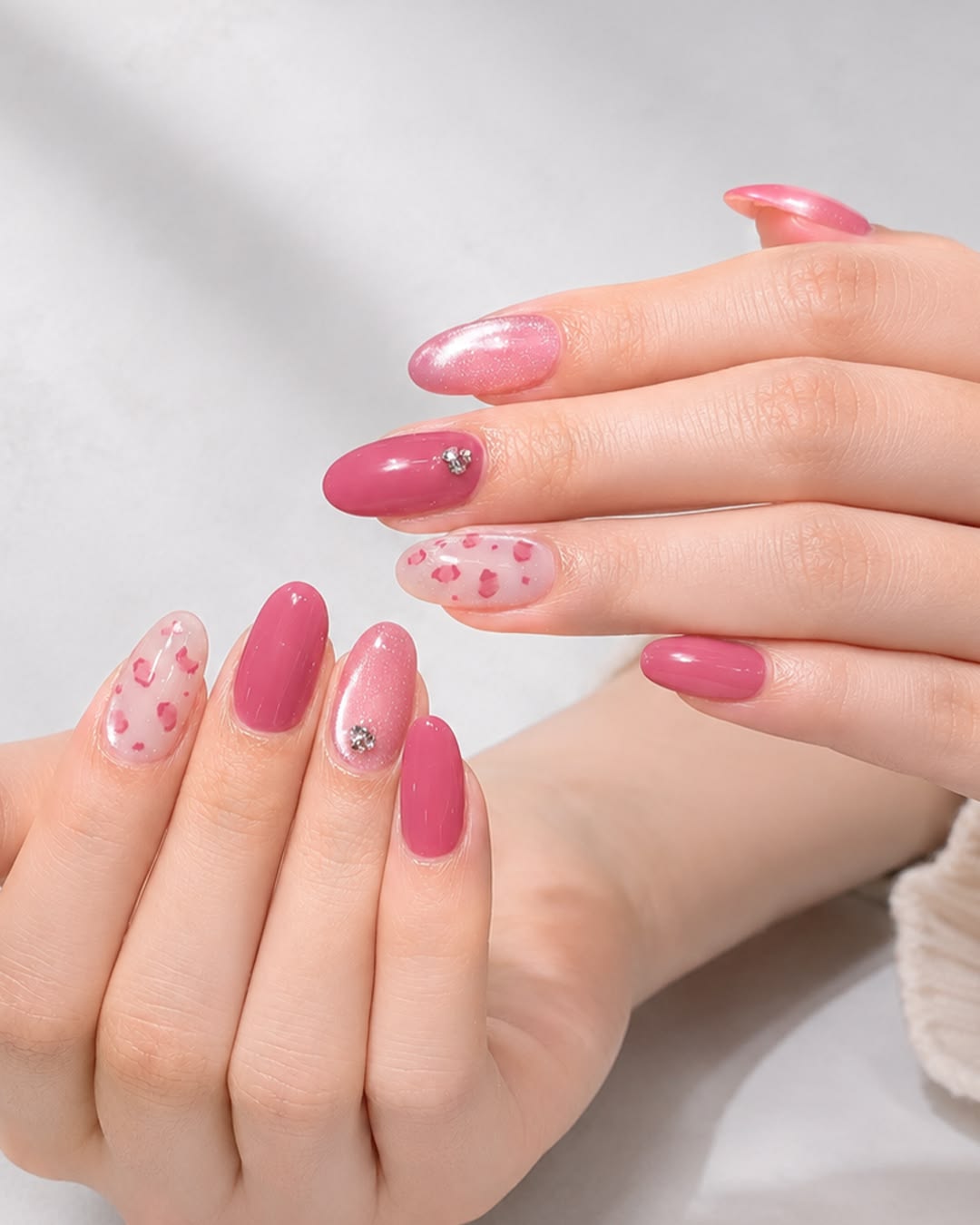 Pink leopard print nails with trendy animal pattern.