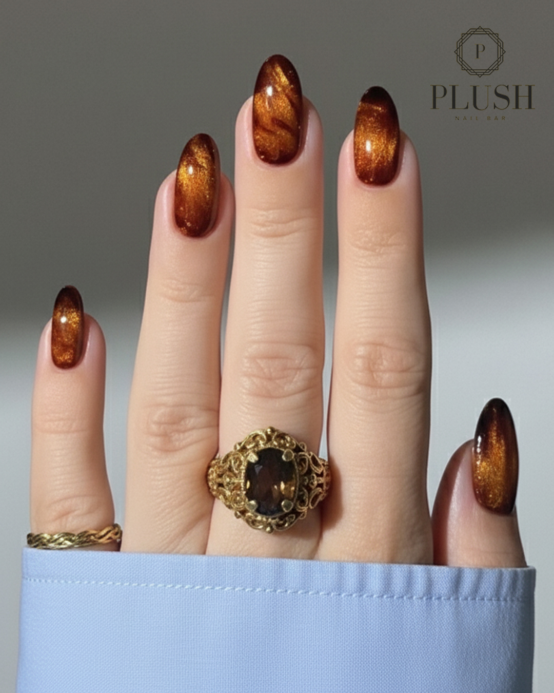 Velvety chrome nails in rich burnt caramel — a glamorous, glowy look for Thanksgiving gatherings.