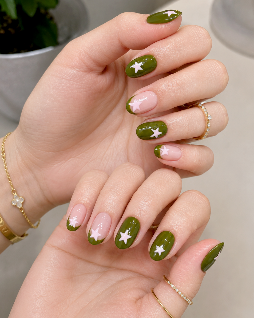 10 Matcha Nails Ideas for a Fresh, Elegant Green Manicure 3 Olive matcha green nails with white star accents and nude negative space details.
