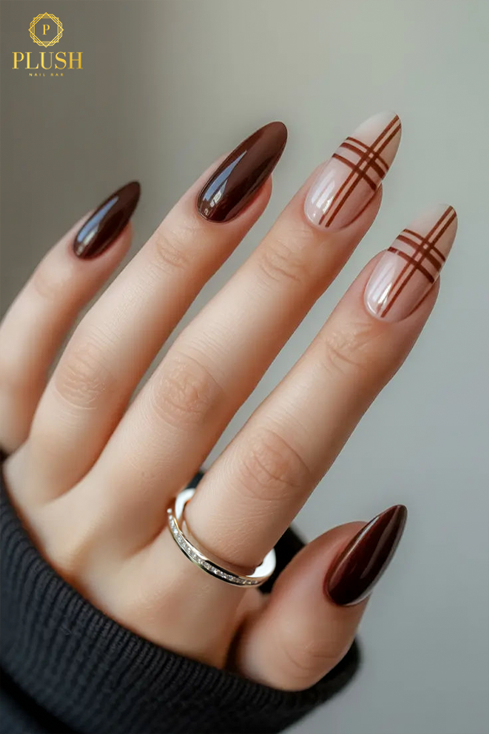 10+ Brown Nail Ideas for a Chic Autumn Look 8 Brown nail ideas for fall 2025: glossy chocolate nails with plaid accents in warm tones.