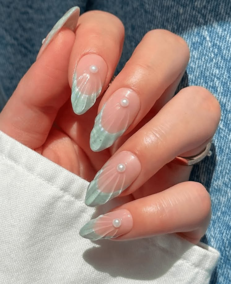Beach vacation mermaid nails with sea glass blue tones and pearl details