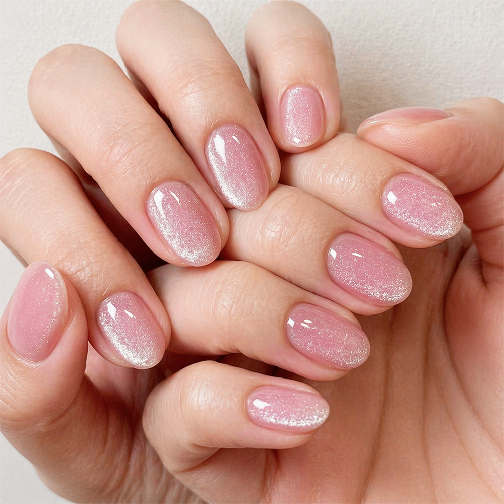 soft pink shimmer nails with a glossy natural finish