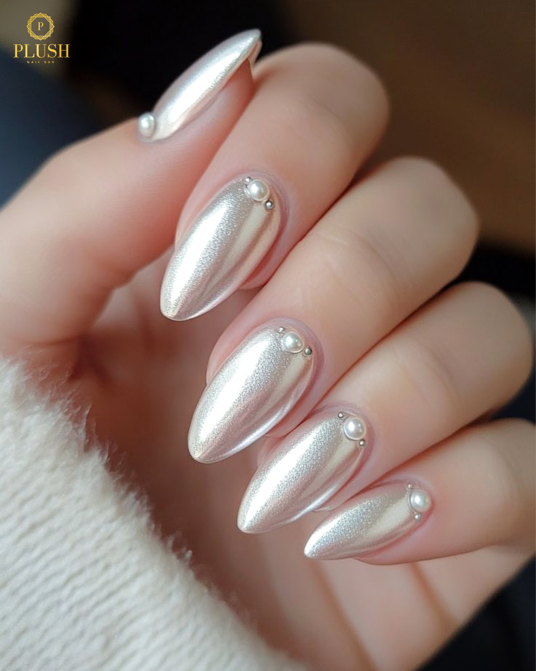 Light pink almond nails with a pearl-glazed finish for a soft, iridescent shine.