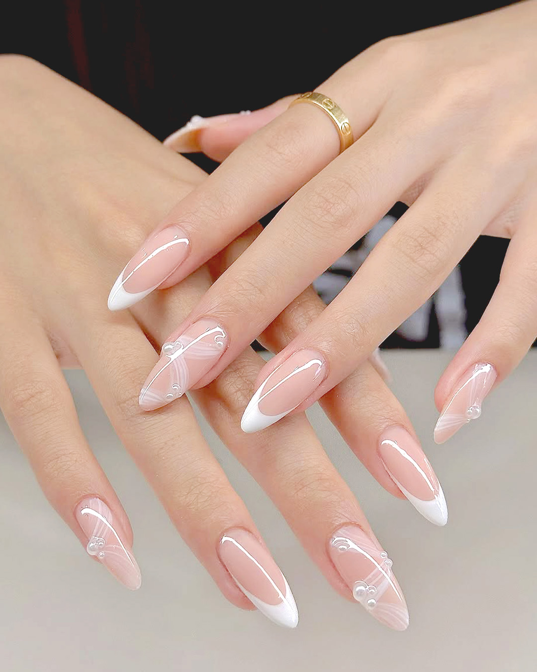 elegant wedding nails with french tip and soft pink base, almond shape bridal nails design