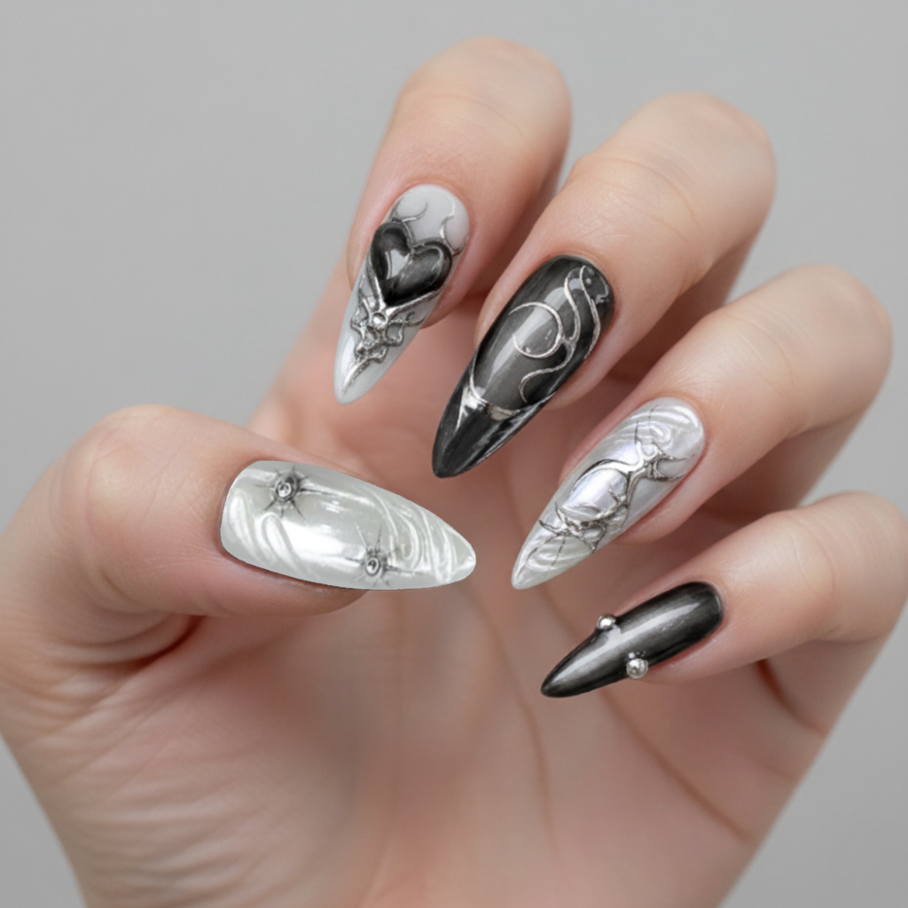 Halloween nails with black, silver, and chrome 3D textures in an elegant gothic style