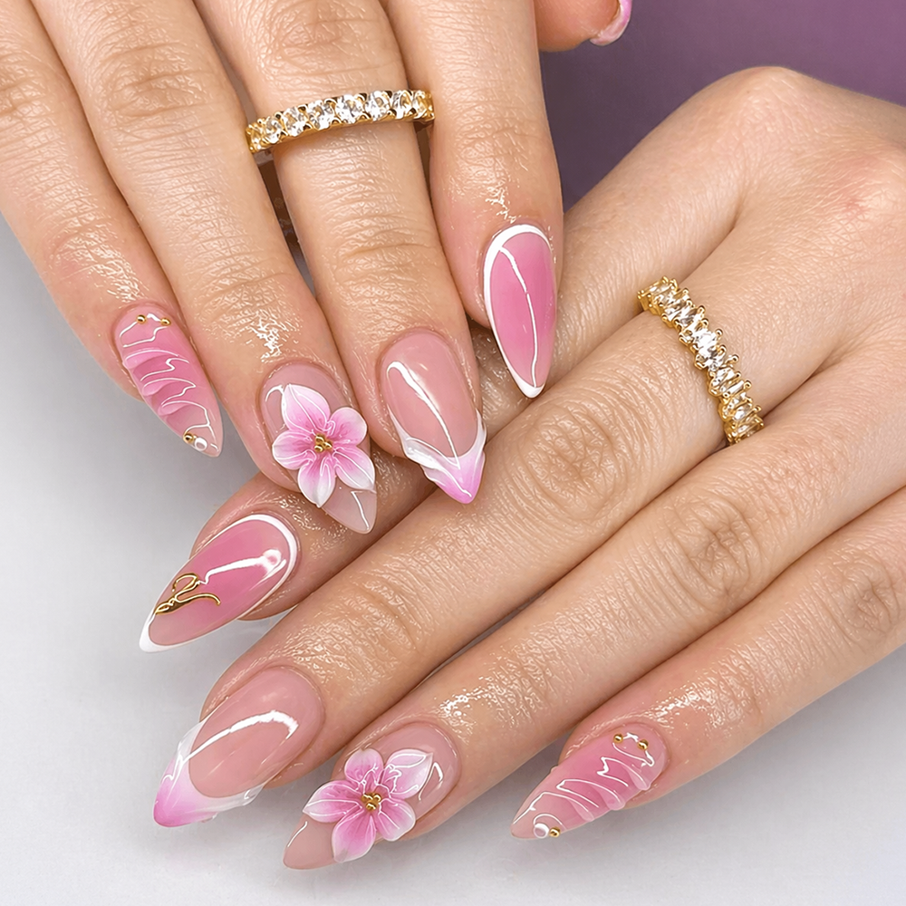 pink french tip nails with floral design and elegant almond shape
