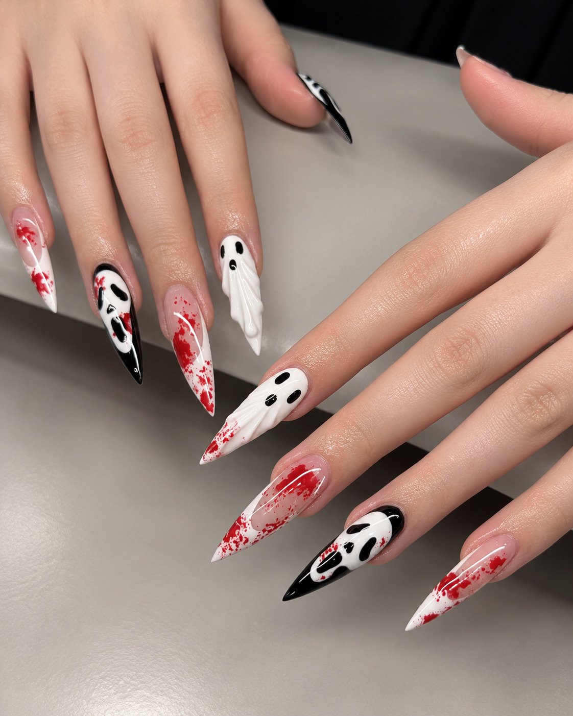 White and black stiletto nails with Ghostface masks, 3D ghosts and red blood splatter French tips