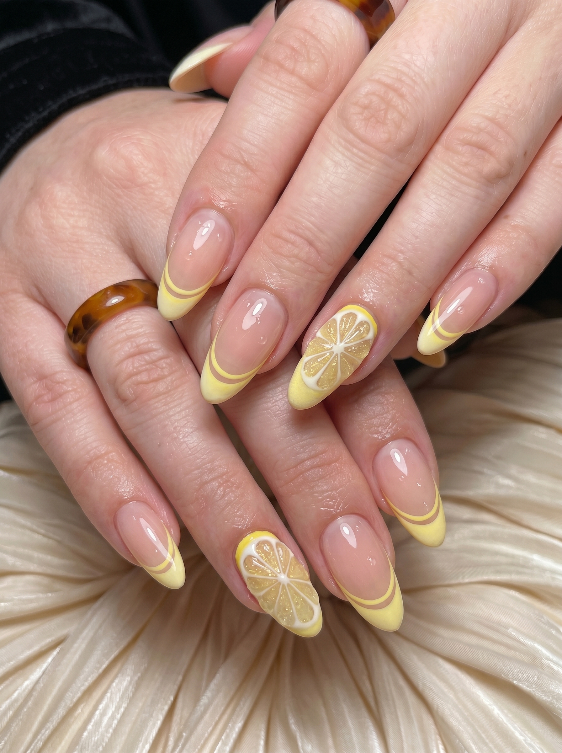 Lemon Nails with yellow French tips and realistic 3D lemon slices at PLUSH NAIL BAR
