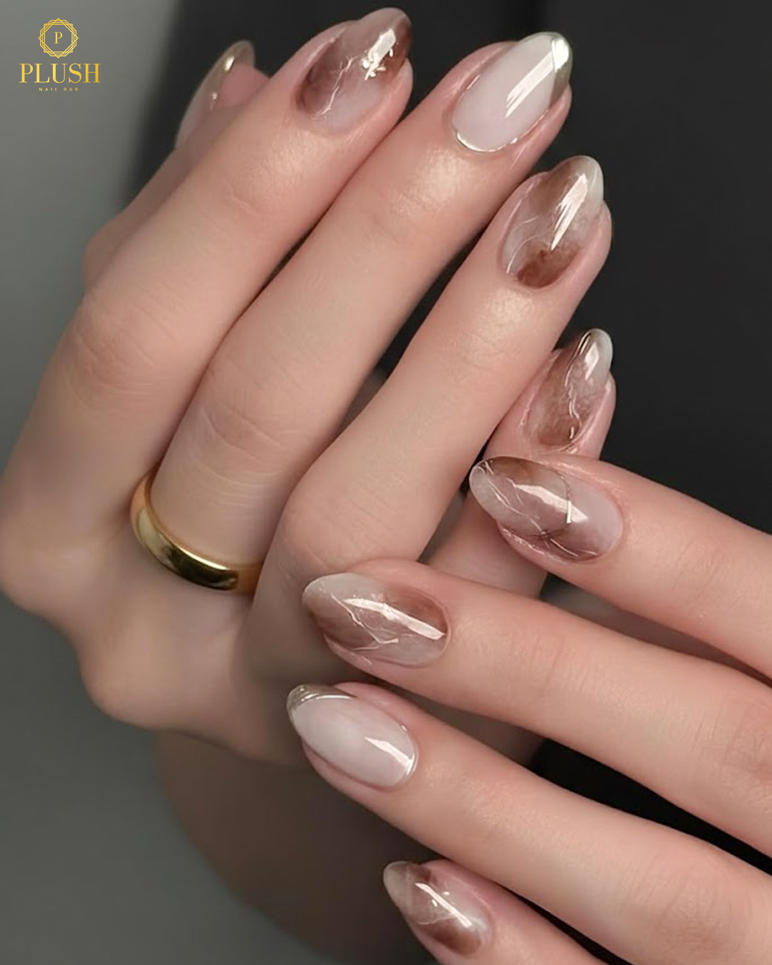 Top 9 Trending Nails at Plush Nail Bar You’ll Love Right Now 4 Nude marble nails with soft brown swirls, modern neutral nail art