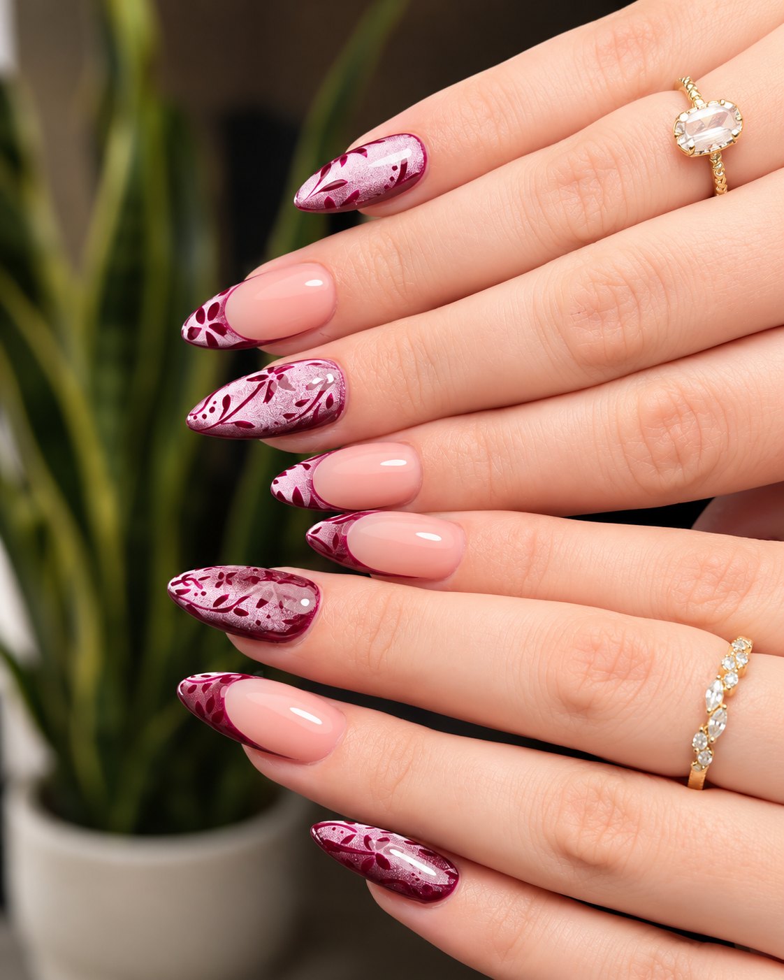 Wine shimmer nails with white floral art and nude French accent nails