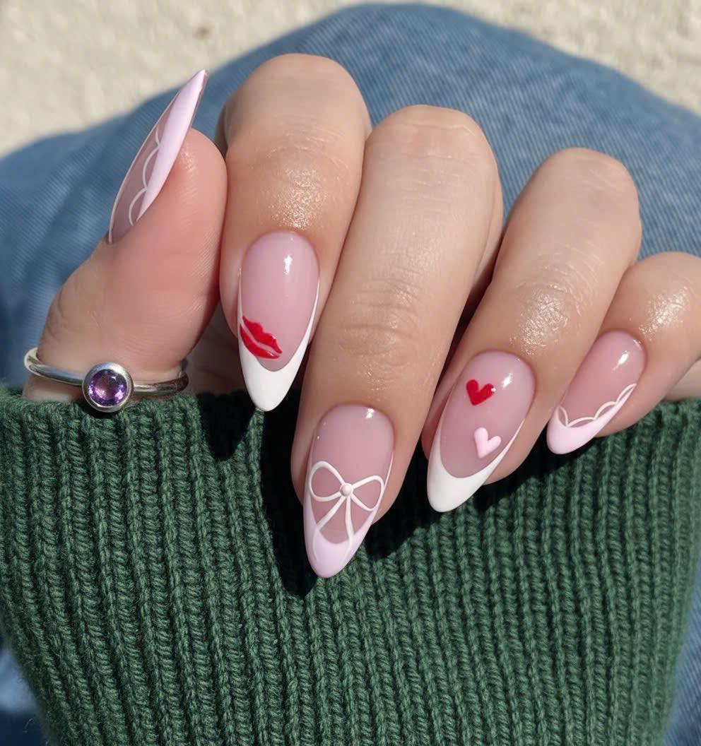Pink French tip valentine nails with hearts and bow details at Plush Nail Bar